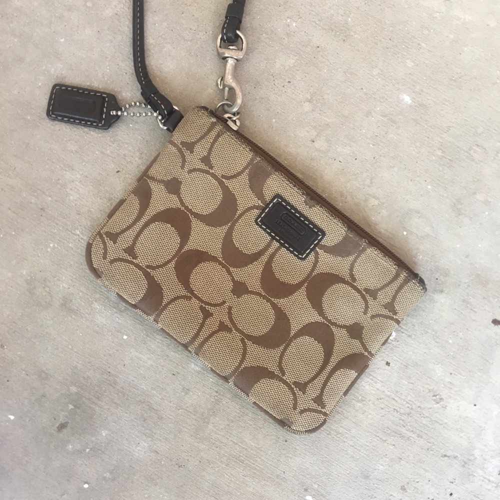 Coach wristlet with leather trim